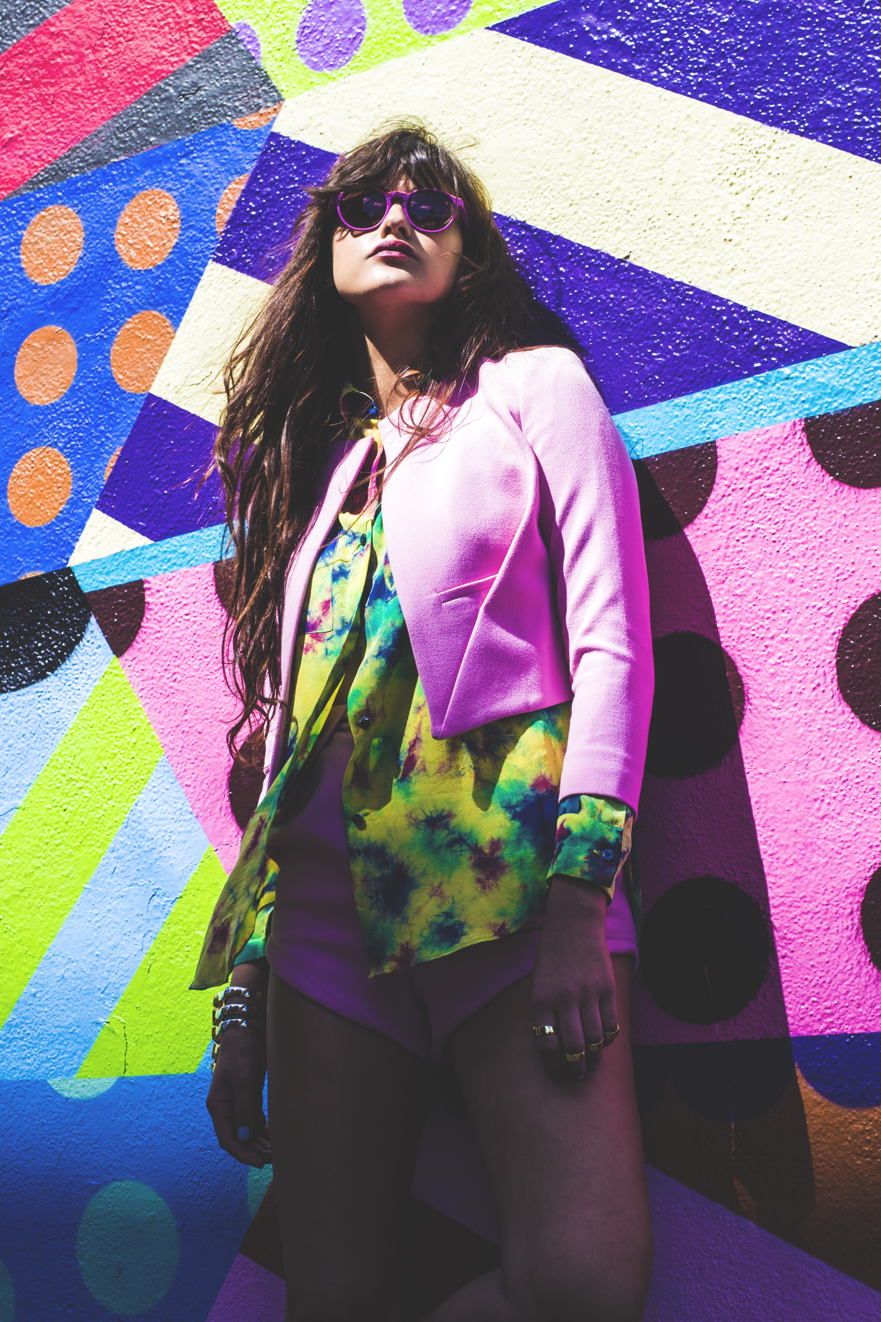 tie dye print silk blouse HOUSE OF HOLLAND. pale pink crepe blazer and matching shorts BALENCIAGA. silver and gold skeleton cuff NOIR. five-finger gold ring set EDDIE BORGO. pink and purple acetate sunglasses VINTAGE. earrings model's own.